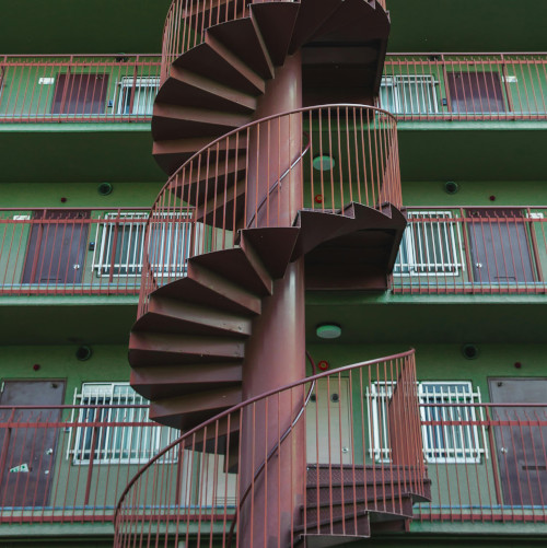 Circular staircase showing three floors of senior apartments